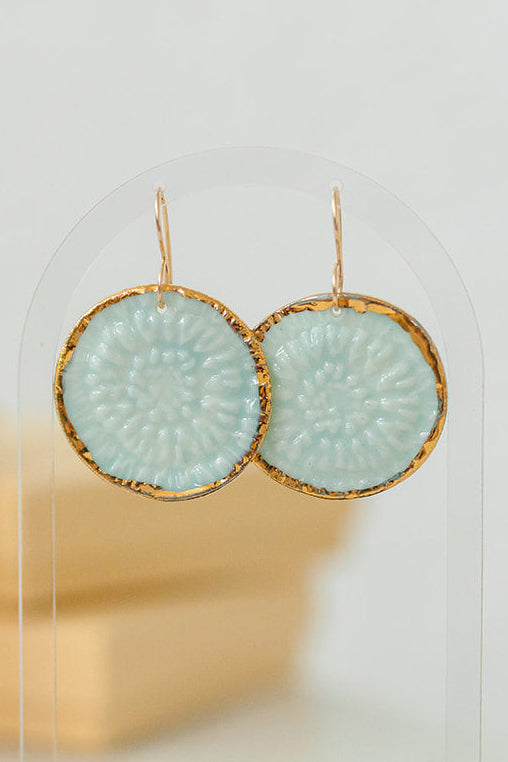 Handcrafted turquoise porcelain earrings with hand-applied 22k gold accents by Silver Harvest Studio.