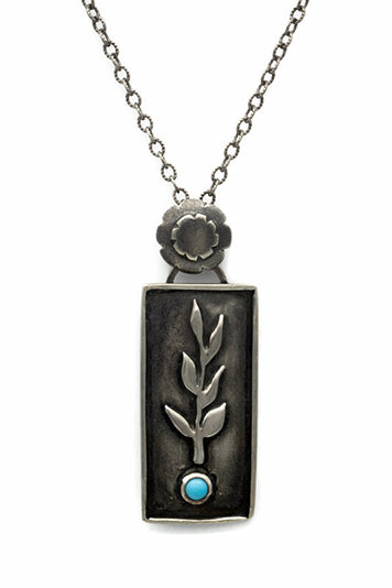 Handcrafted sterling silver necklace with a botanical branch design and Sleeping Beauty turquoise stone.